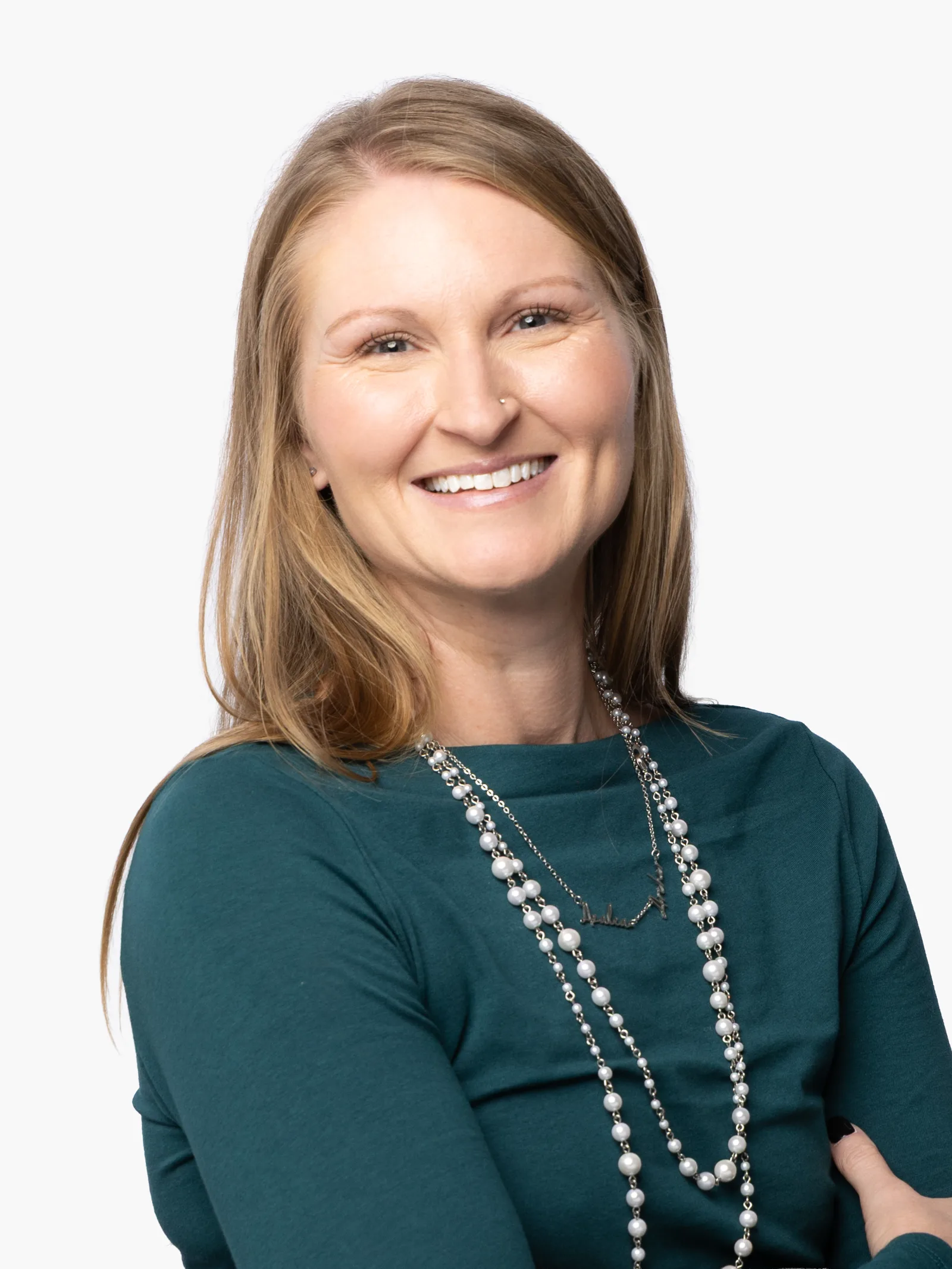 SQA Services executive portrait — woman in teal in matched studio lighting