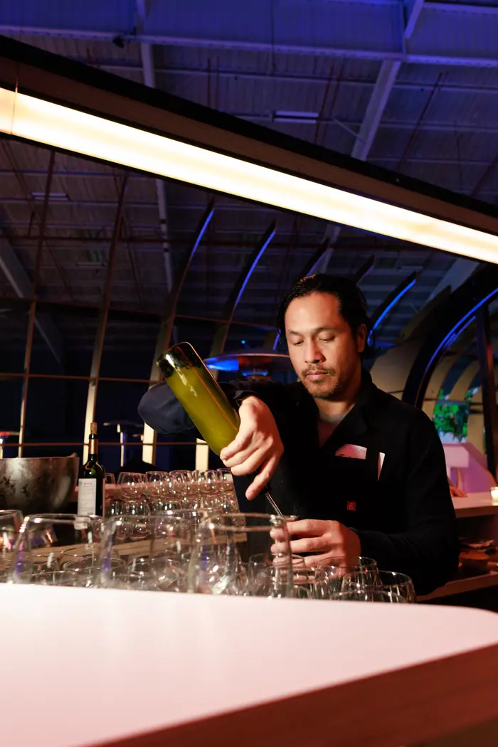 A bartender pouring at the hangar bar