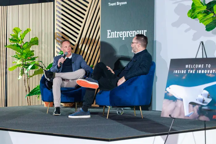 Trent Bryson and JetZero co-founder Tom O'Leary in armchairs on the Grit Rising stage