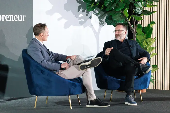 Trent Bryson and Tom O'Leary mid-exchange during the on-stage conversation