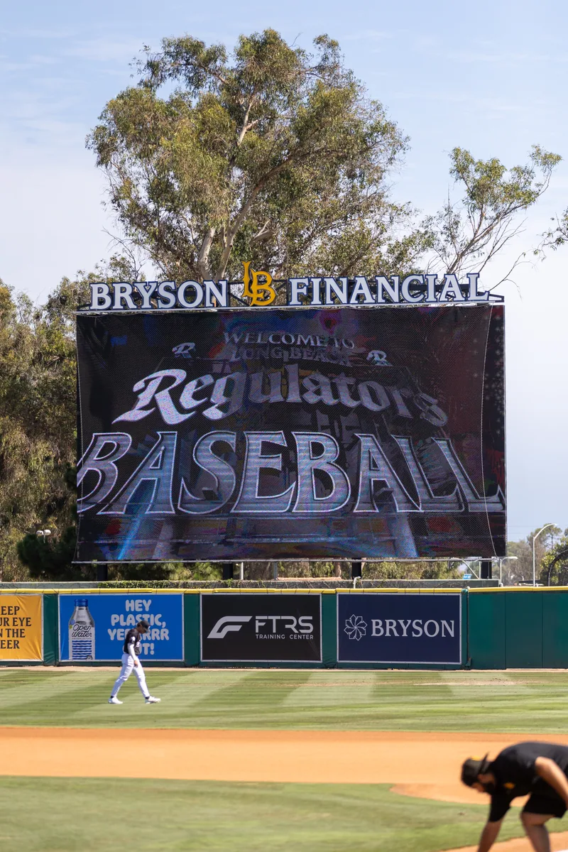 The videoboard reading Welcome to Long Beach Regulators Baseball under a Bryson Financial header