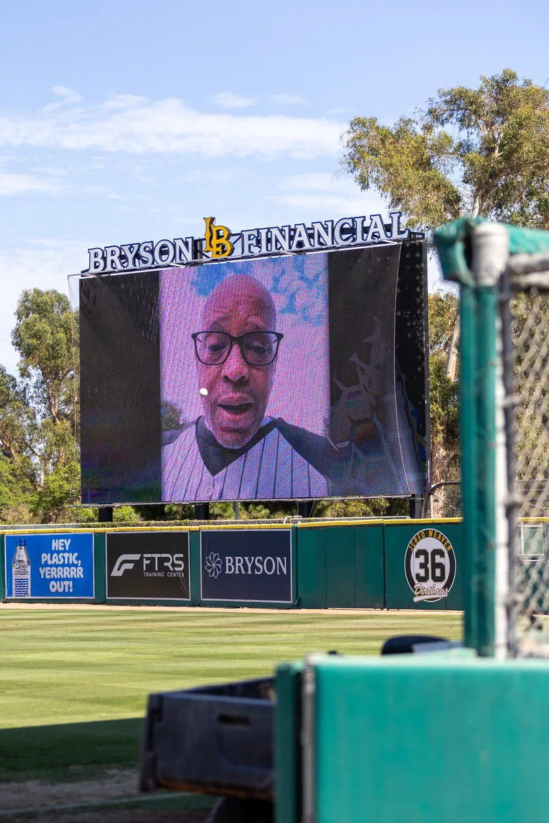 A pre-game tribute playing on the videoboard beneath the Bryson Financial sign