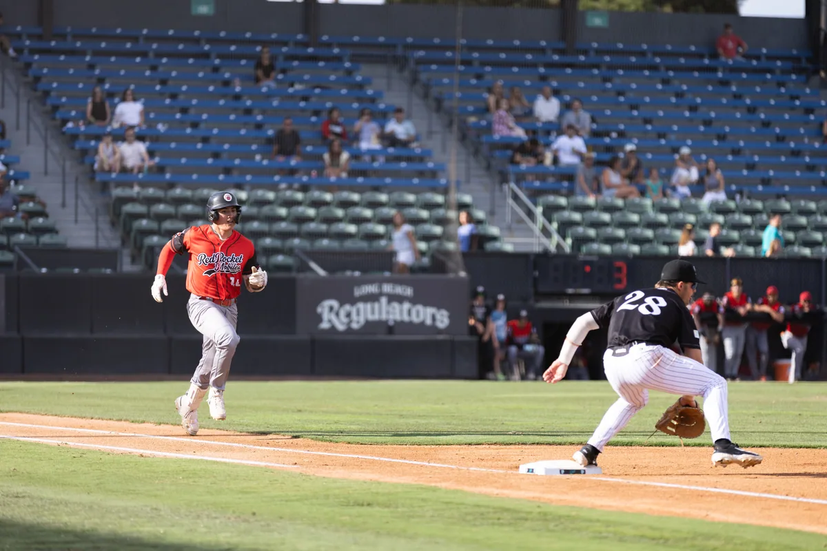 A runner breaks for second as the infield turns