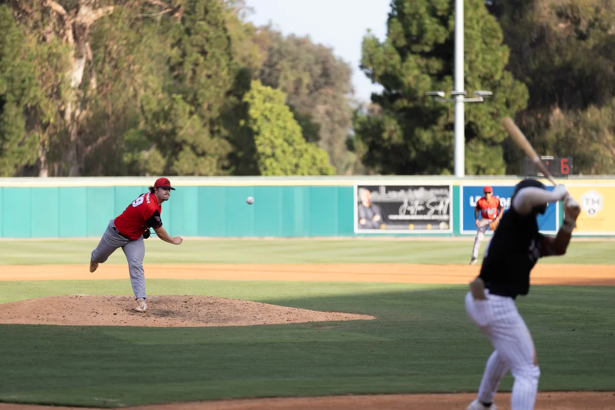 A right-hander at full extension in the afternoon light