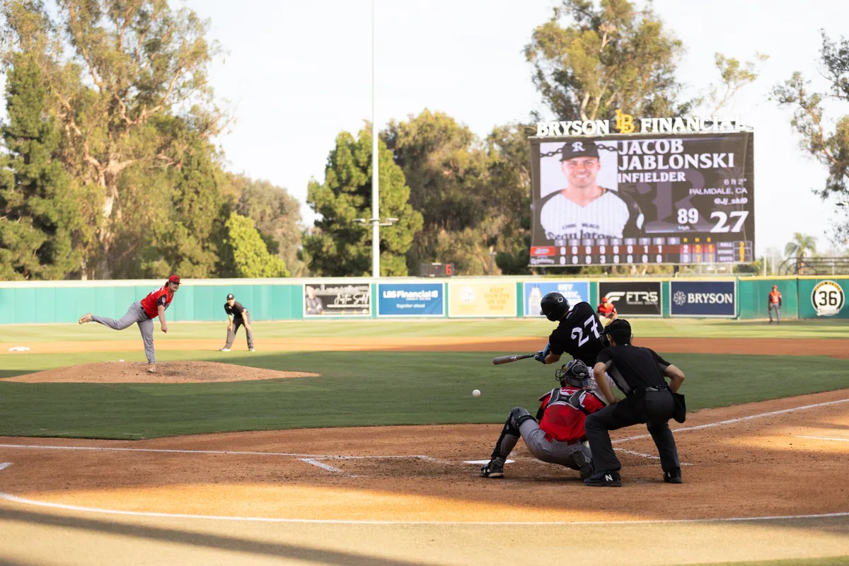 A player card on the board with the line score below