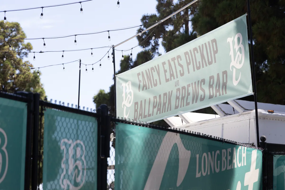 Outfield sponsor boards and the bullpen bar along the right field line