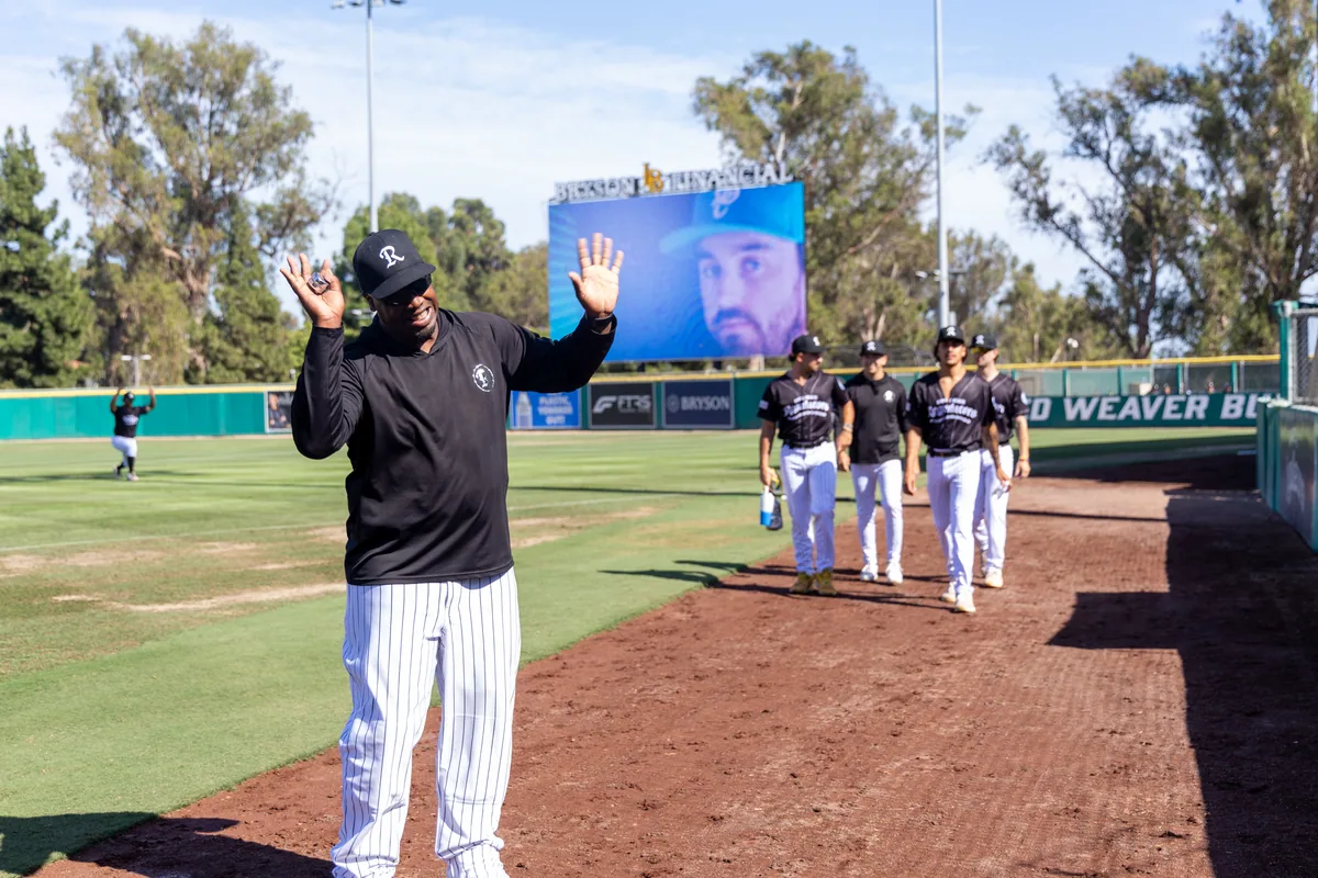 A pre-game ceremony with the videoboard lit behind the infield