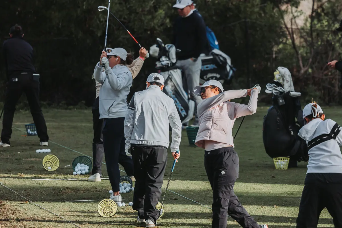 Players and caddies working the full length of the range at Palos Verdes Golf Club during Fir Hills Seri Pak Championship warm-up