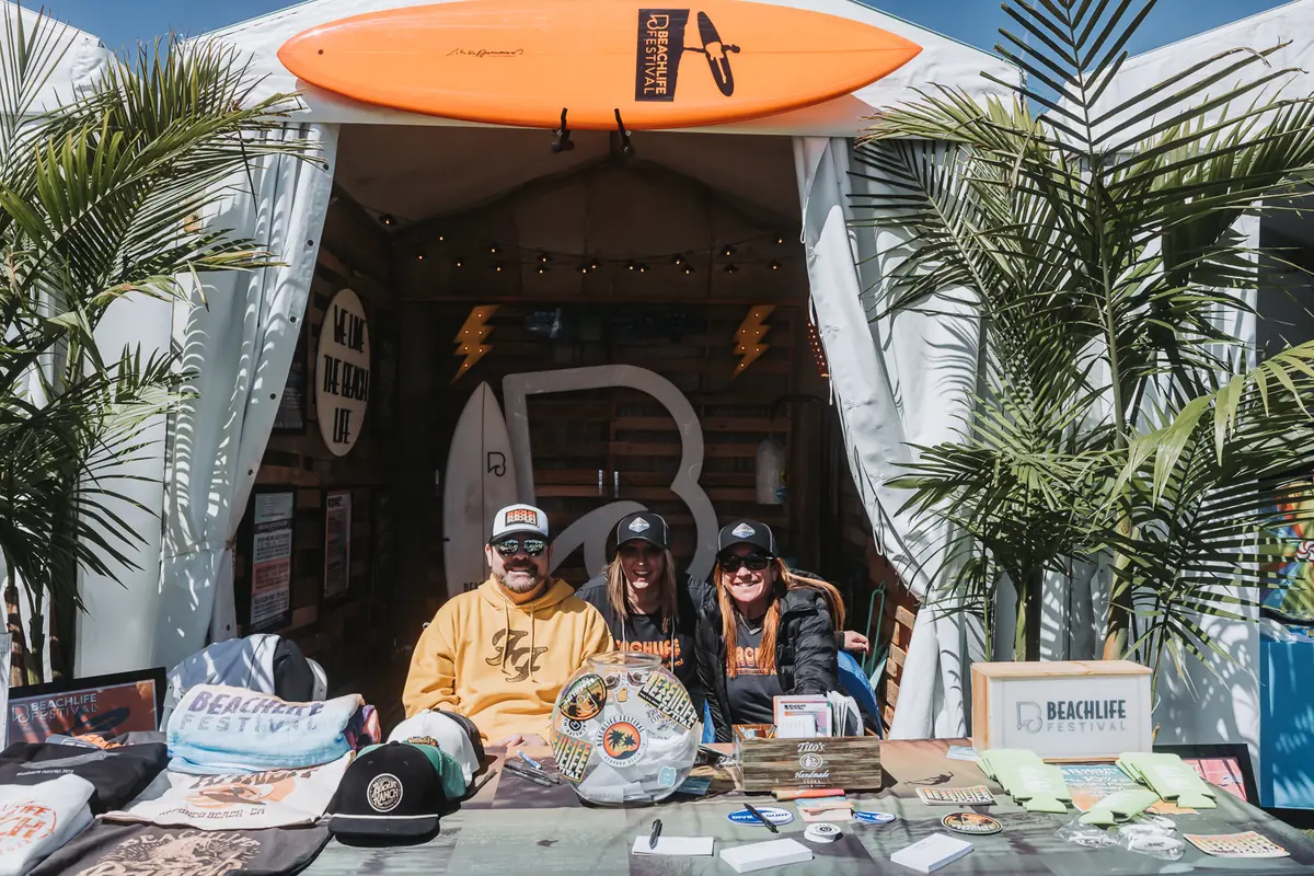 A surfboard-hung pop-up shop trading on the spectator path