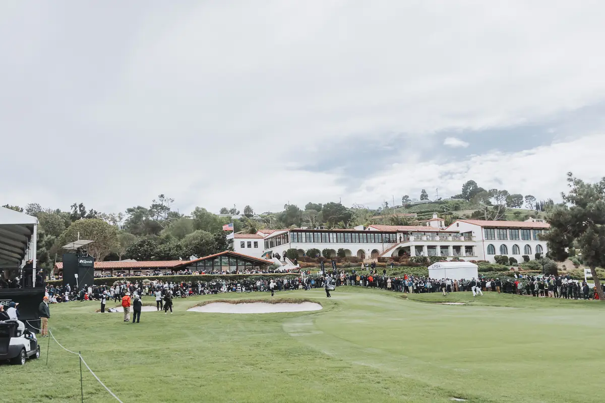 The Palos Verdes Golf Club clubhouse seen across the 18th green with the gallery banked along the hillside below it