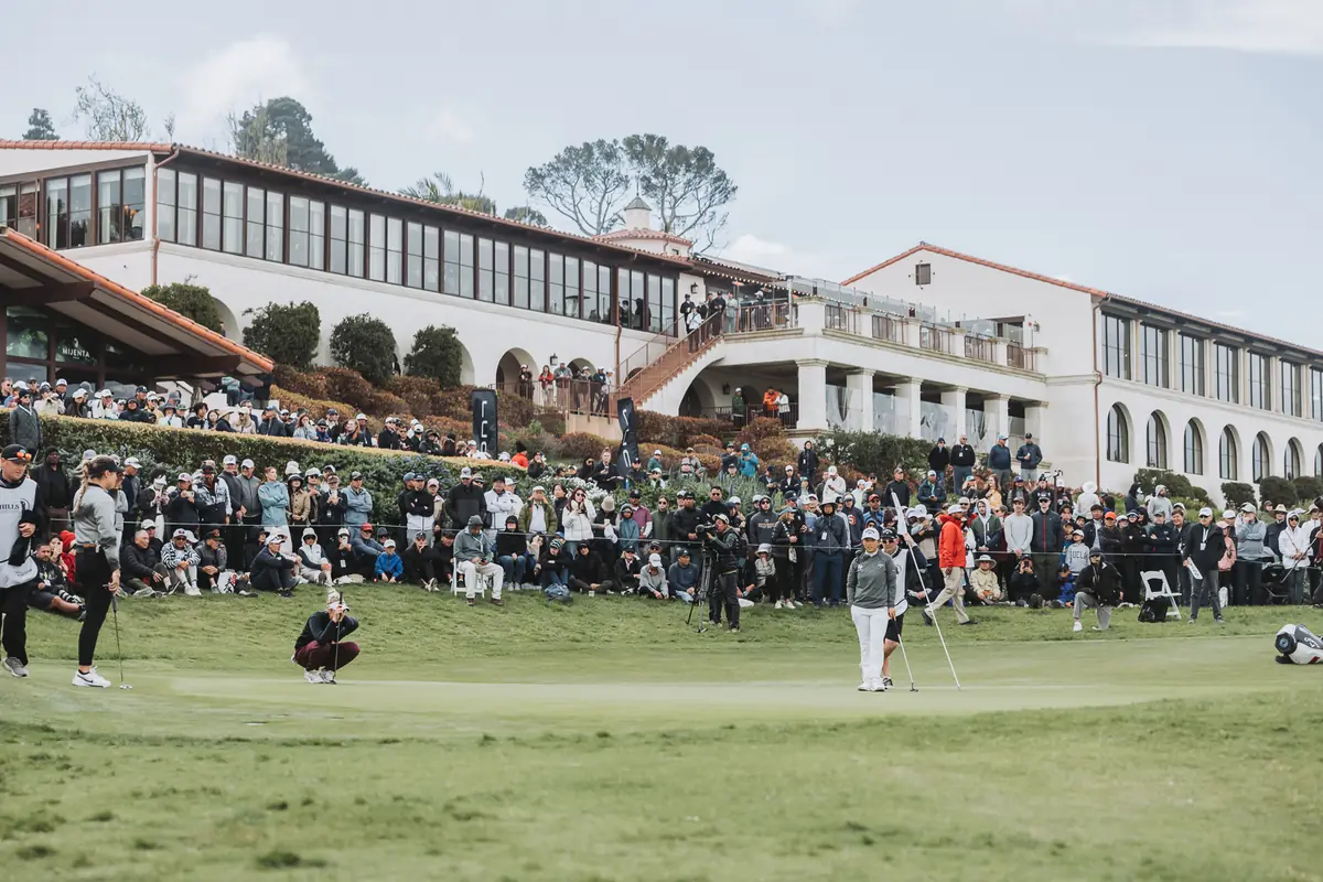 Every terrace and balcony of the clubhouse full of members and spectators watching the closing hole