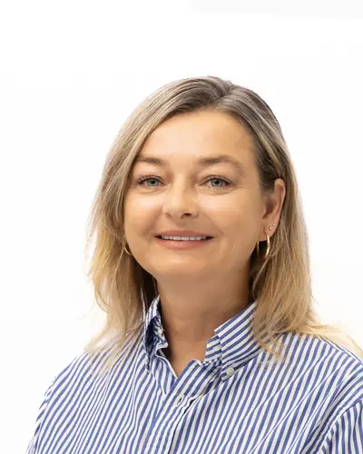 Team member in a blue striped shirt