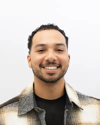 Team member in a plaid overshirt