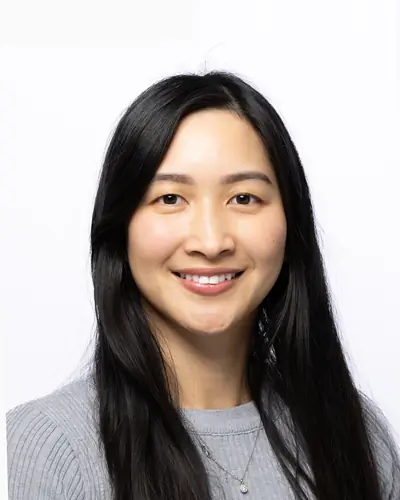 Team member in a grey knit