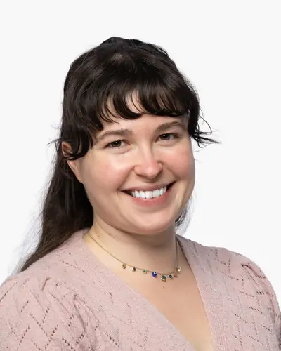 Team member in a soft pink knit