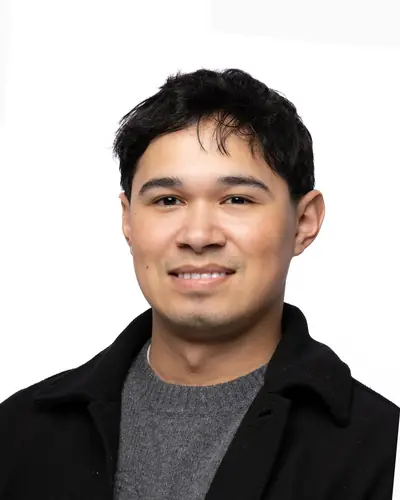 Team member in a black overshirt