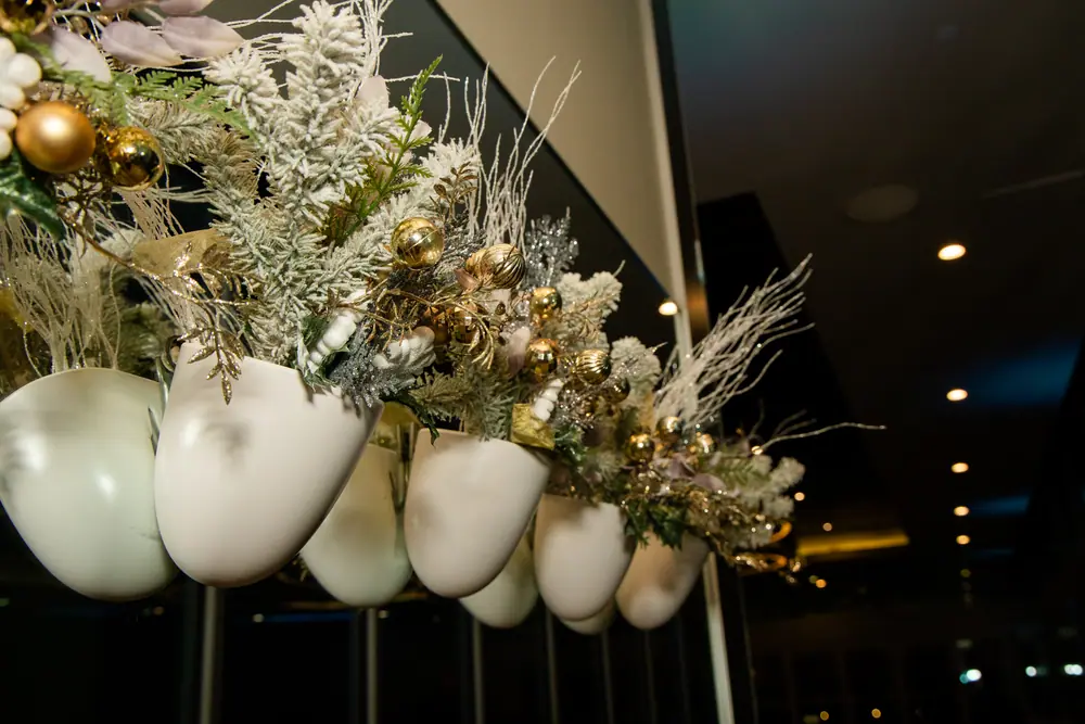 Gold and white floral installation running along the Sky Level balcony rail at Shade Hotel Redondo Beach